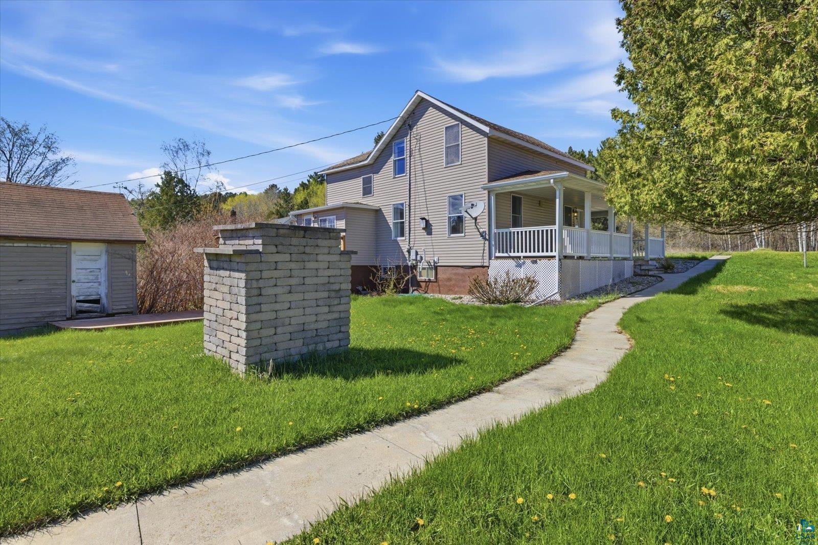 50 Main Street Soudan, MN 55782 - Photo 31 of 31 Two-story residence featuring light gray siding and white trim