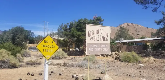 a sign that is on the side of a road