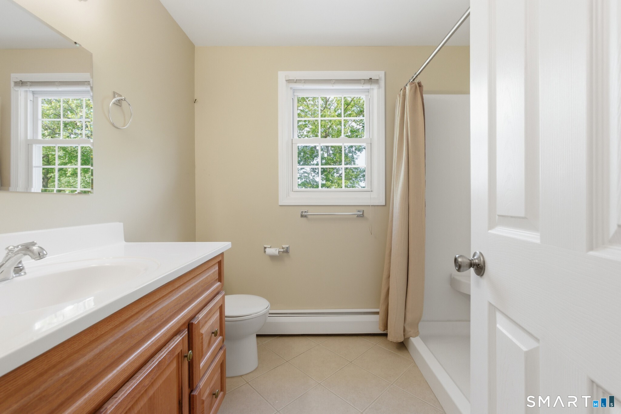 70 Mahoney Road Colchester, CT 06415 - Photo 23 of 40 a bathroom with a sink a toilet and a window