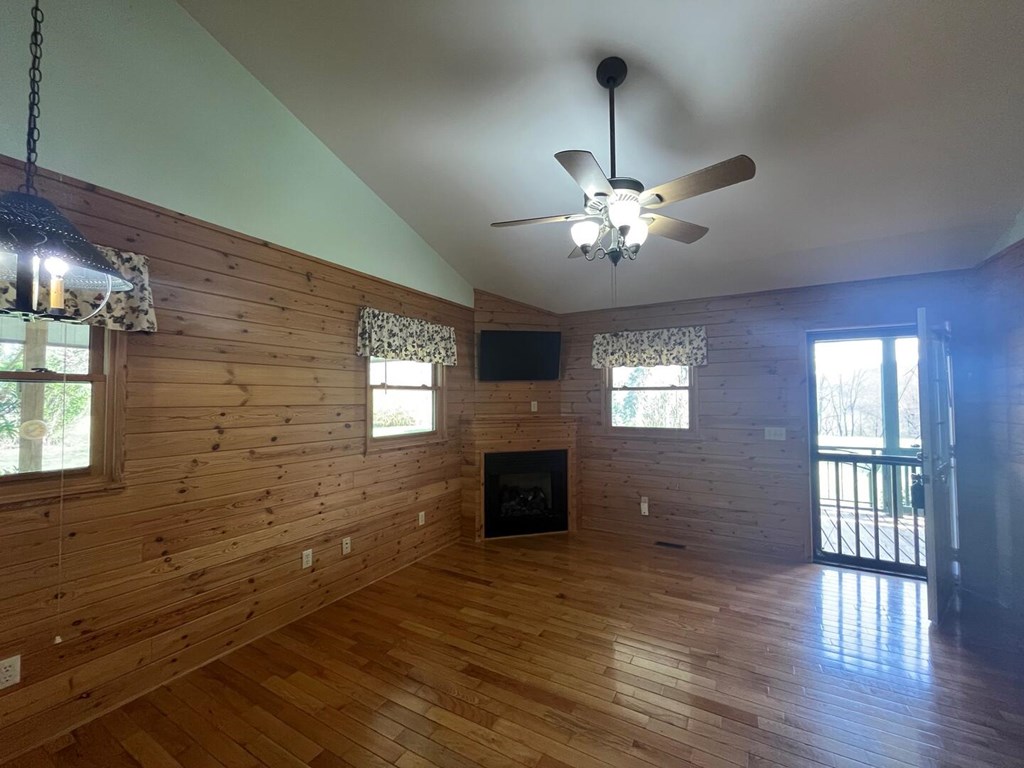 142 Arrowhead Trail Hayesville, NC 28904 - Photo 11 of 41 a view of an empty room with wooden floor and a window