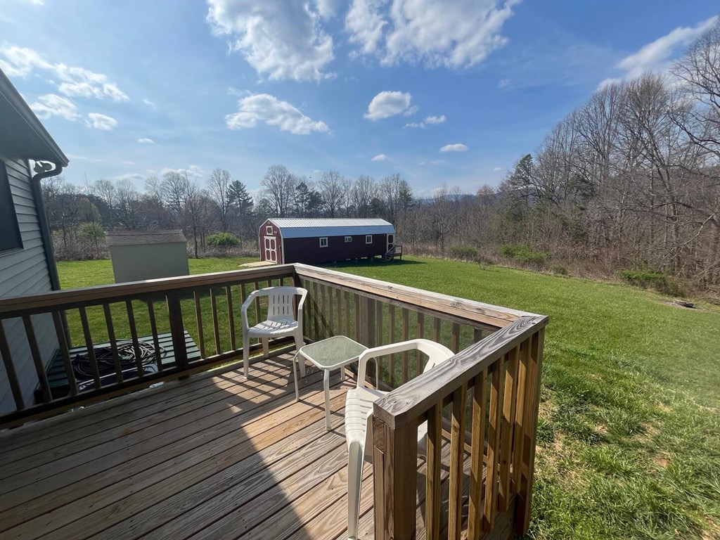 142 Arrowhead Trail Hayesville, NC 28904 - Photo 13 of 41 a view of a balcony with wooden floor and iron fence