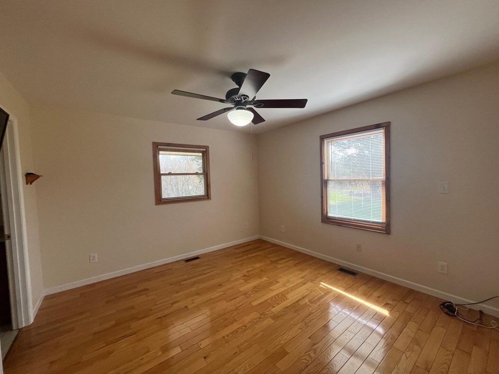 142 Arrowhead Trail Hayesville, NC 28904 - Photo 14 of 41 an empty room with a window and a ceiling fan