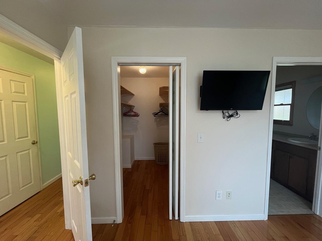142 Arrowhead Trail Hayesville, NC 28904 - Photo 15 of 41 a view of a livingroom with wooden floor and flat screen tv