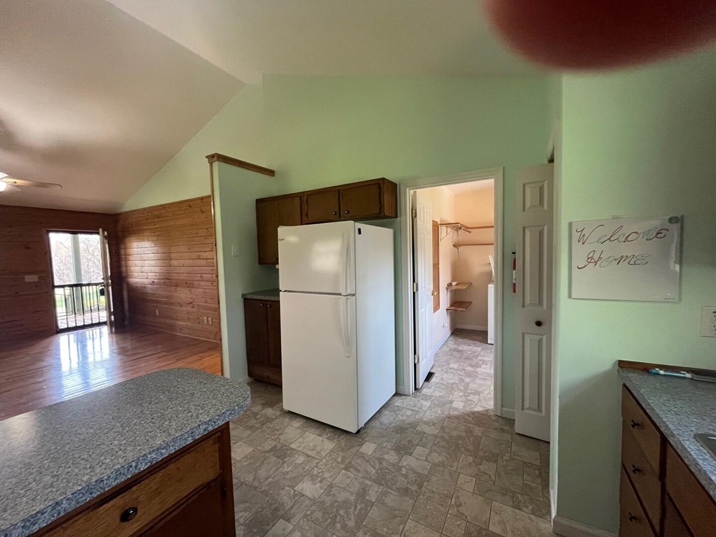 142 Arrowhead Trail Hayesville, NC 28904 - Photo 7 of 41 a kitchen with a refrigerator and a sink