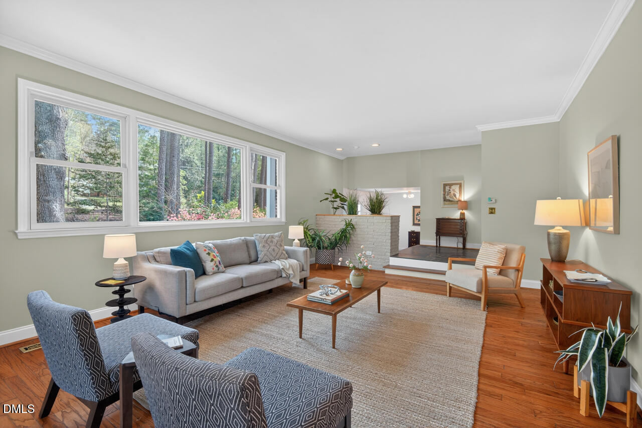 2734 Spencer Street Durham, NC 27705 - Photo 11 of 61 a living room with furniture and a large window
