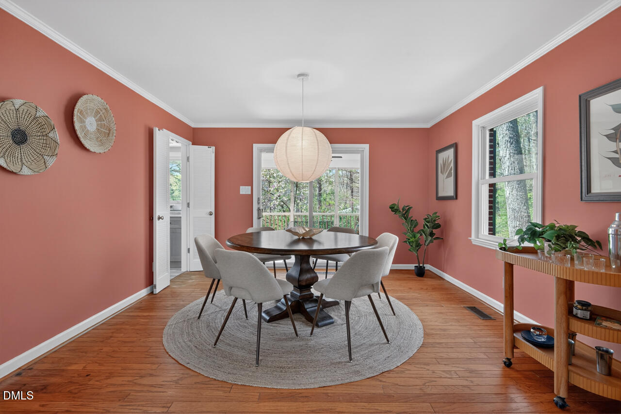 2734 Spencer Street Durham, NC 27705 - Photo 16 of 61 a view of a dining room with furniture window and wooden floor