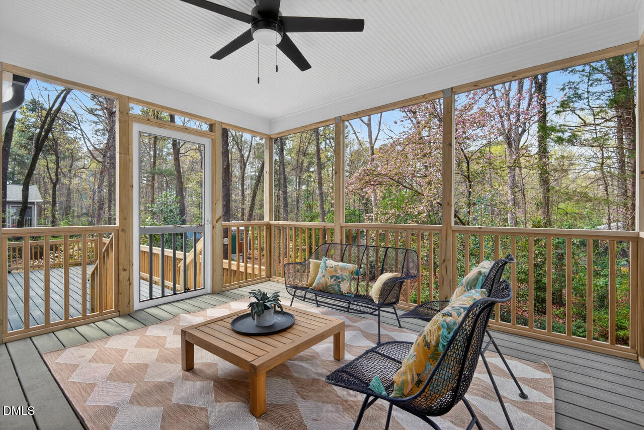 2734 Spencer Street Durham, NC 27705 - Photo 21 of 61 a living room with furniture and a floor to ceiling window