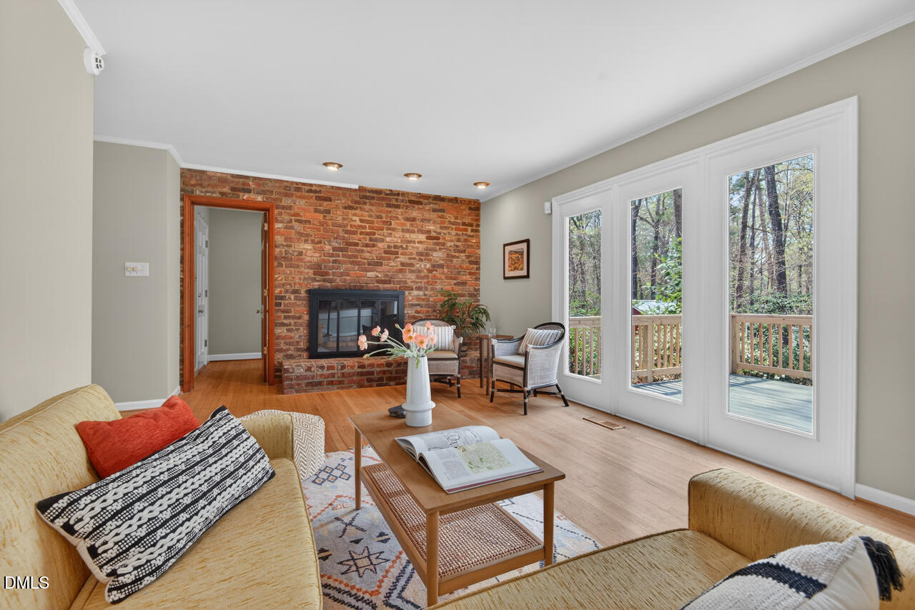 2734 Spencer Street Durham, NC 27705 - Photo 29 of 61 a living room with furniture and a fireplace