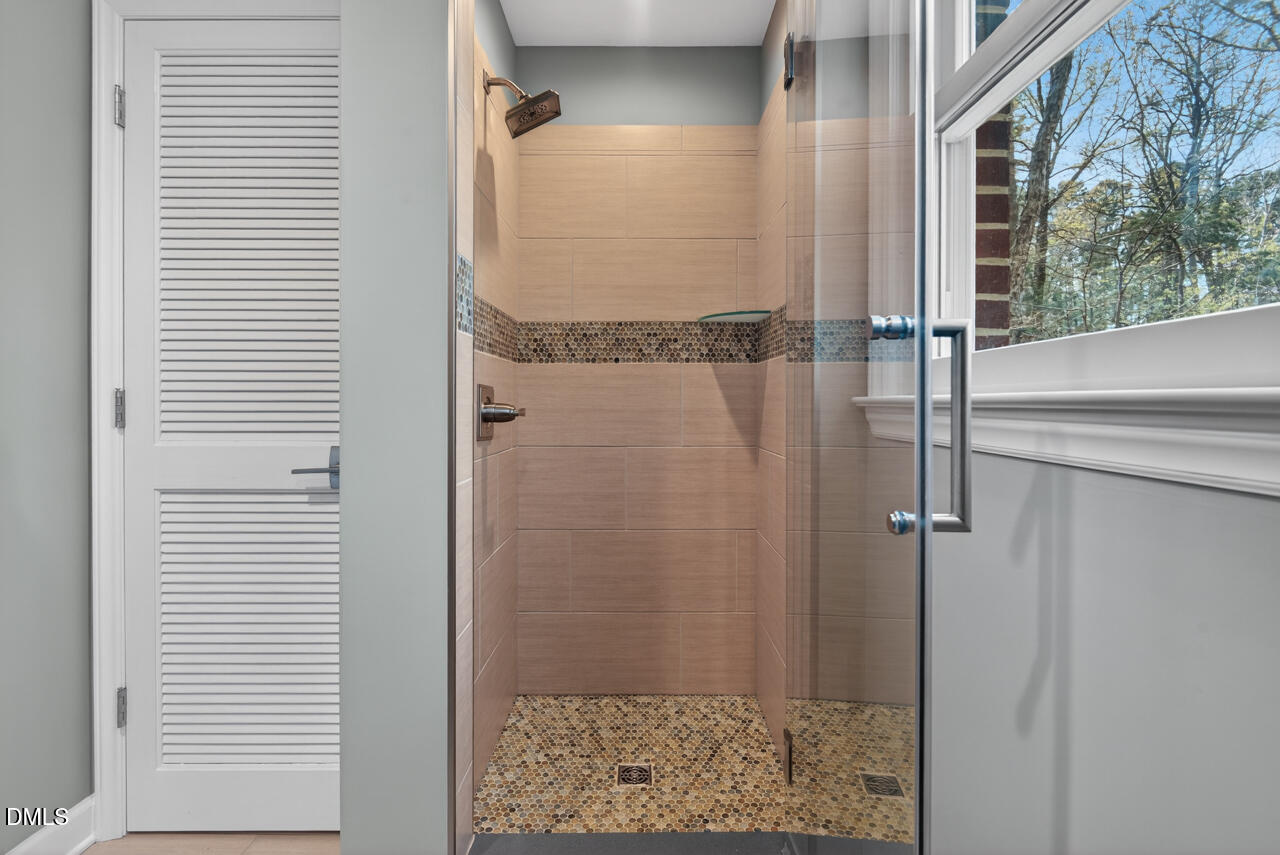 2734 Spencer Street Durham, NC 27705 - Photo 34 of 61 a bathroom with a shower