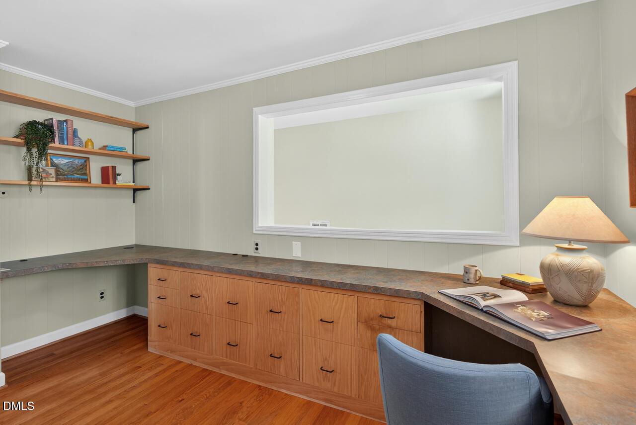 2734 Spencer Street Durham, NC 27705 - Photo 43 of 61 a room with a wooden floor and a window