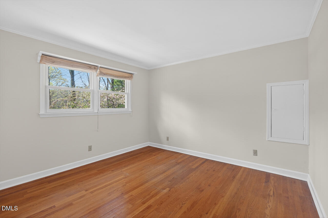 2734 Spencer Street Durham, NC 27705 - Photo 50 of 61 a view of a room with wooden floor and window