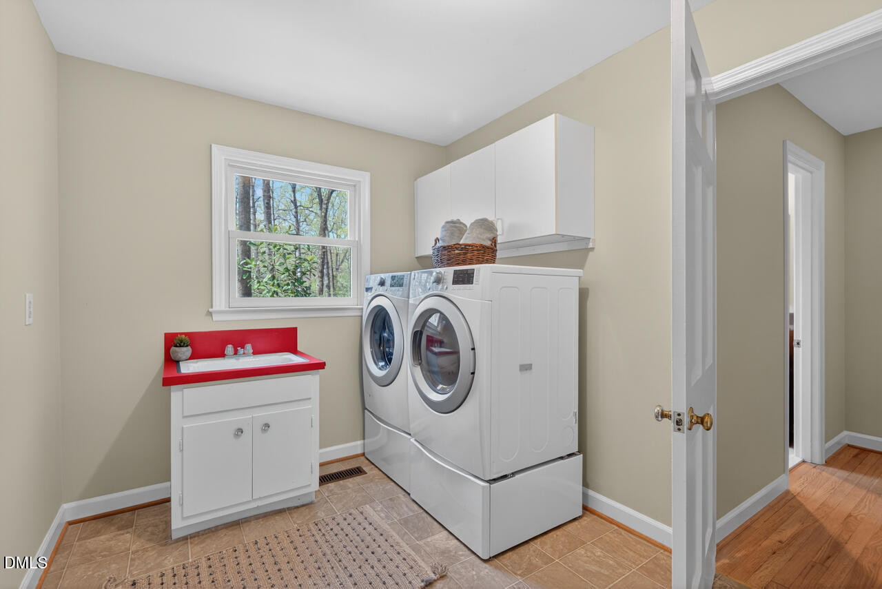 2734 Spencer Street Durham, NC 27705 - Photo 51 of 61 a utility room with dryer and washer