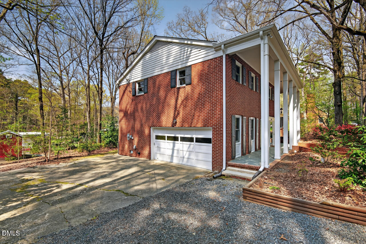 2734 Spencer Street Durham, NC 27705 - Photo 52 of 61 a front view of a house with a yard