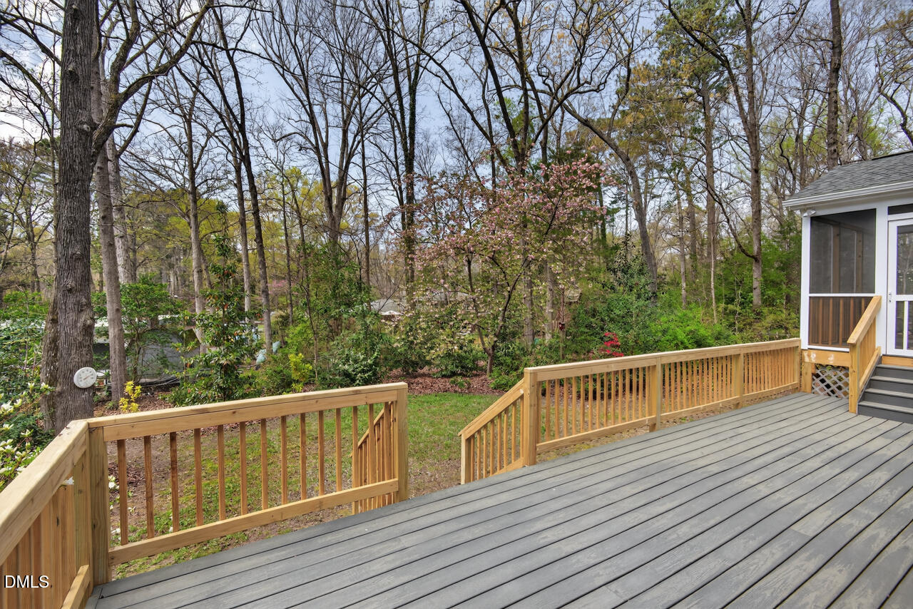 2734 Spencer Street Durham, NC 27705 - Photo 57 of 61 a view of roof deck with wooden floor and fence
