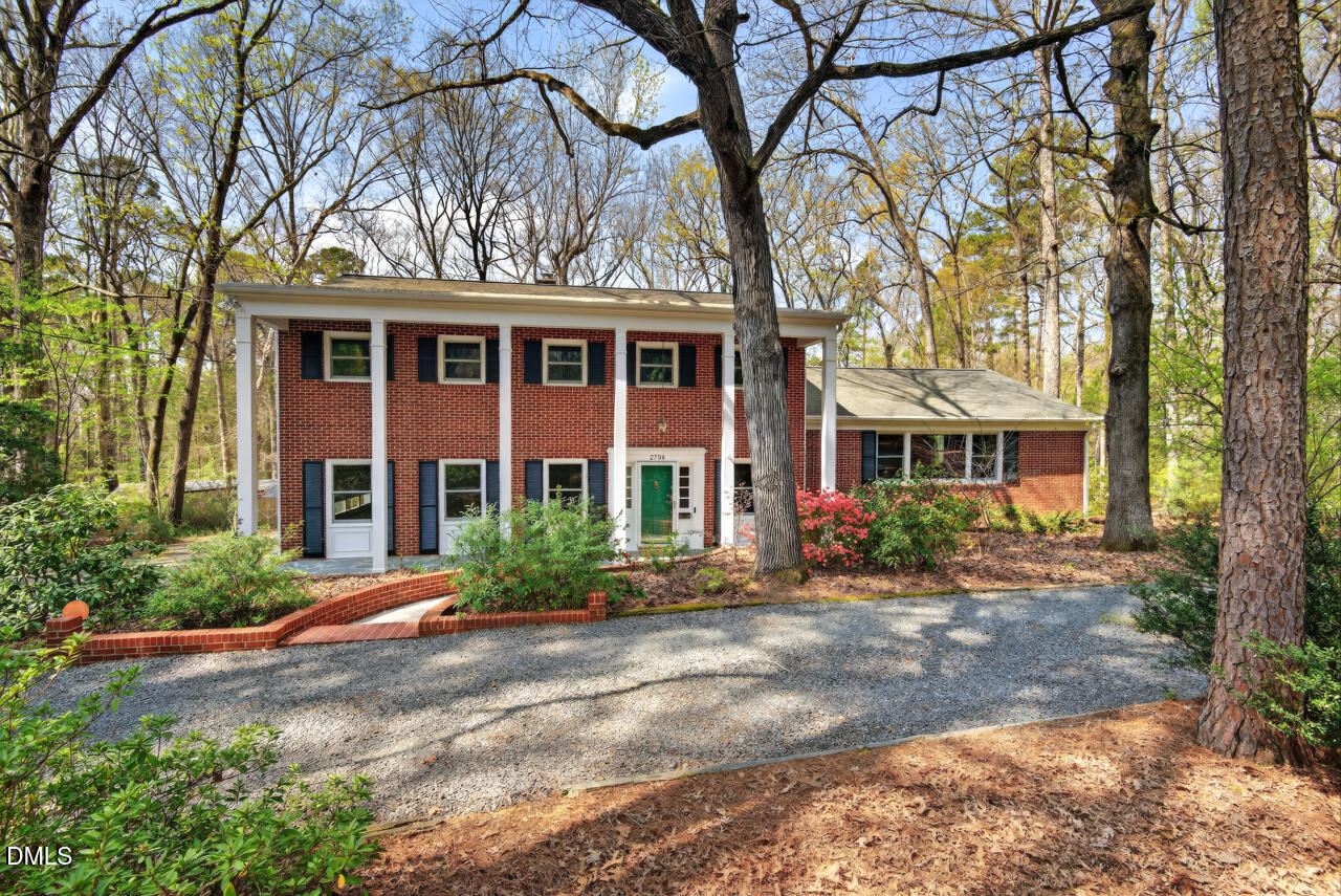 2734 Spencer Street Durham, NC 27705 - Photo 59 of 61 a front view of a house with yard and trees around