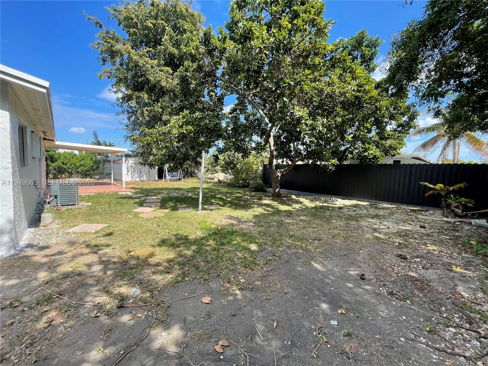 29711 Southwest 146th Avenue Homestead, FL 33033 - Photo 3 of 10 Backyard and covered Patio