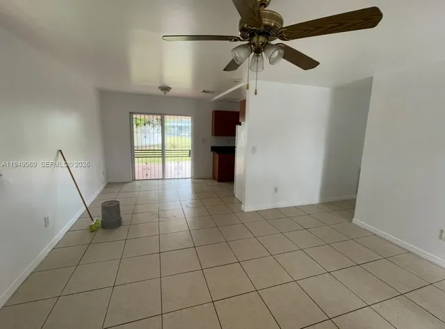 a view of a livingroom with a furniture and a ceiling fan