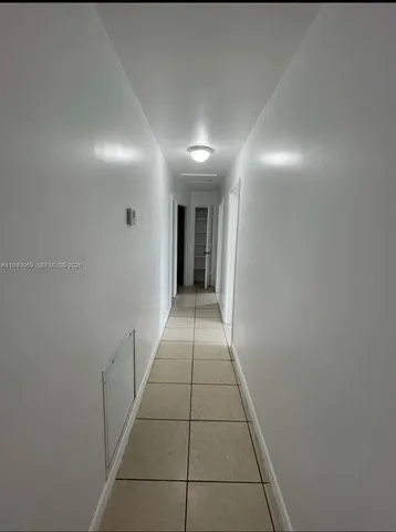 a view of hallway with a window