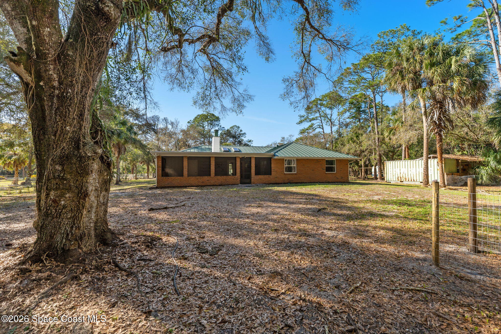 3975 Corey Road Malabar, FL 32950 - Photo 35 of 53 a front view of a house with a yard