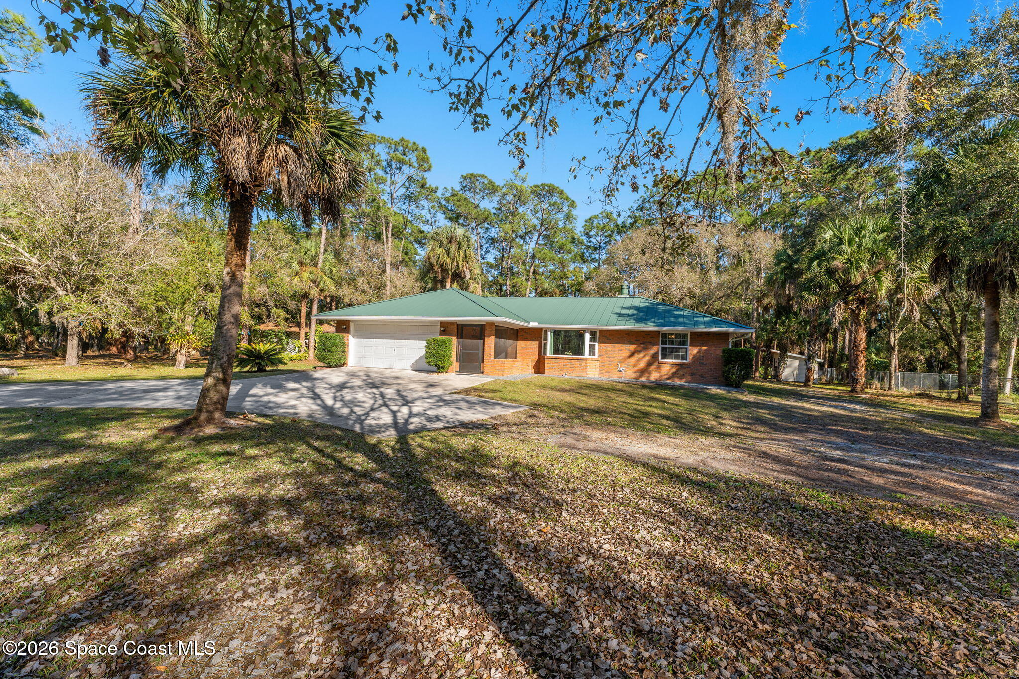 3975 Corey Road Malabar, FL 32950 - Photo 39 of 53 a front view of a house with a yard