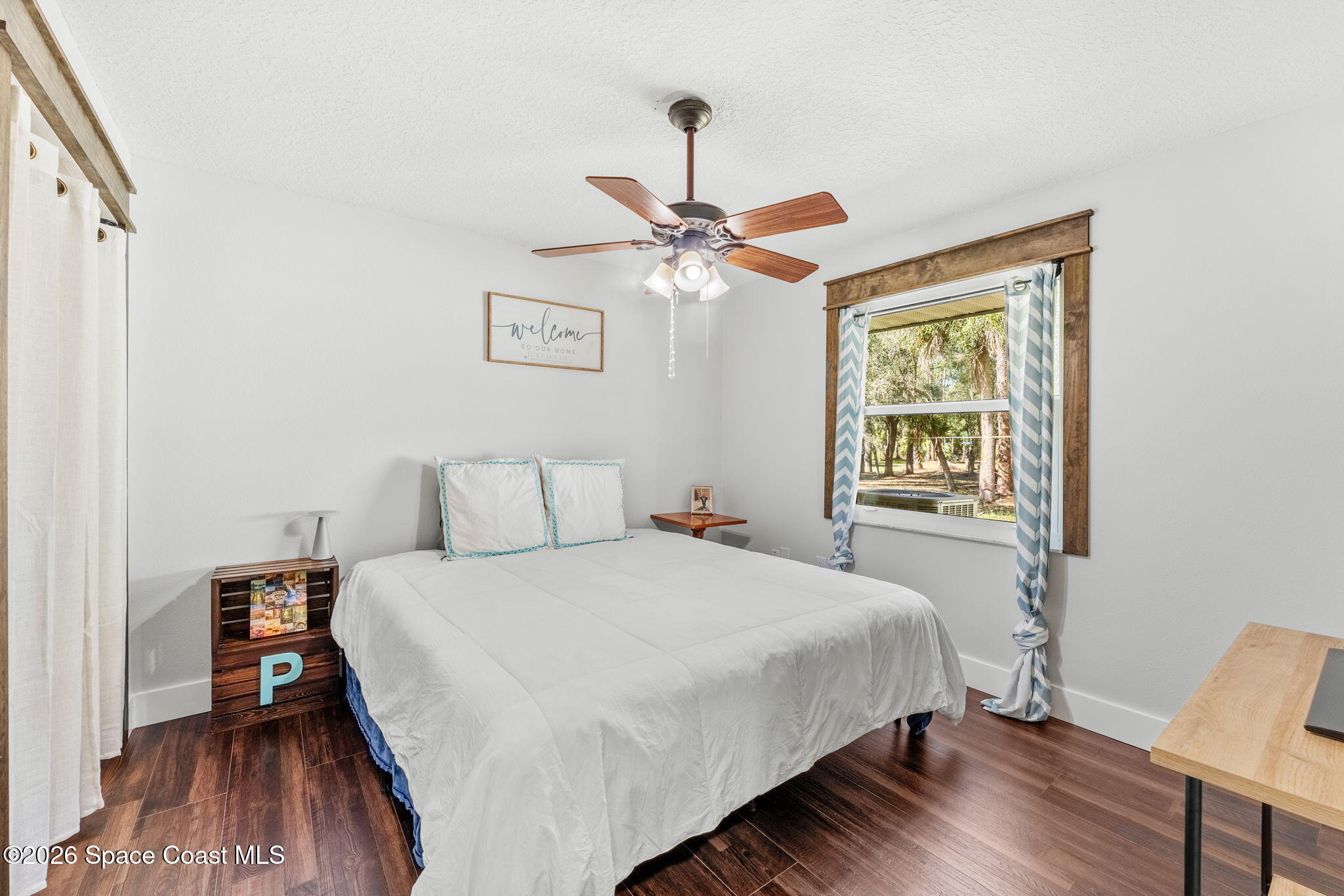 3975 Corey Road Malabar, FL 32950 - Photo 10 of 53 a bedroom with a bed and a window