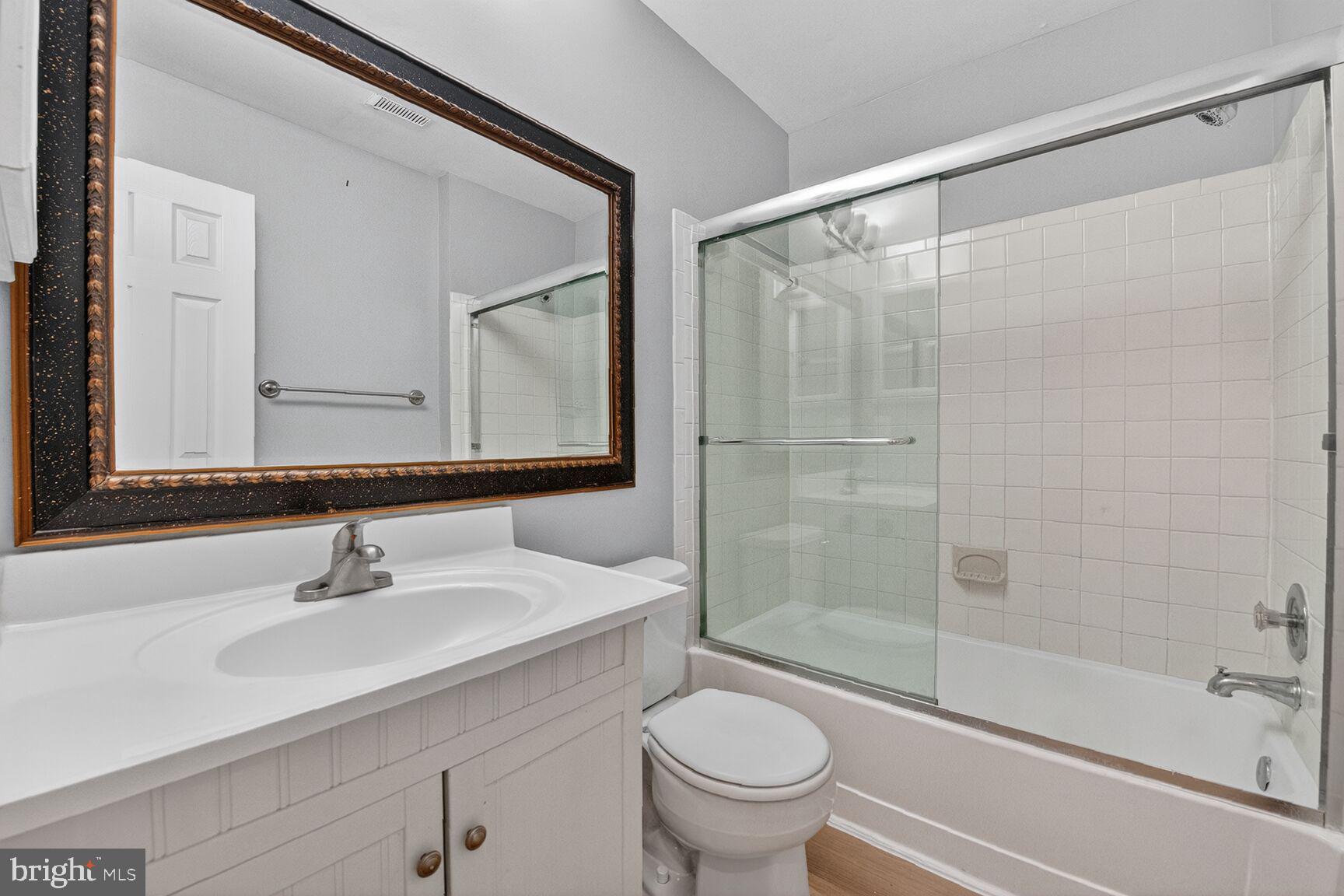 14 Braxton Drive Sterling, VA 20165 - Photo 11 of 28 a bathroom with a shower sink vanity mirror and toilet