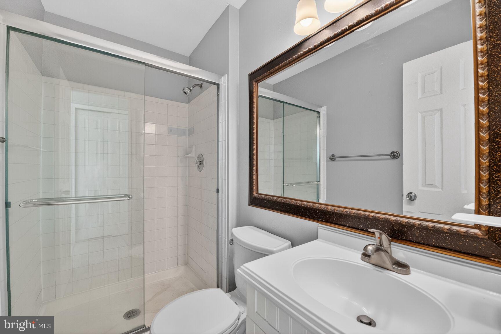 14 Braxton Drive Sterling, VA 20165 - Photo 16 of 28 a bathroom with a sink toilet and shower