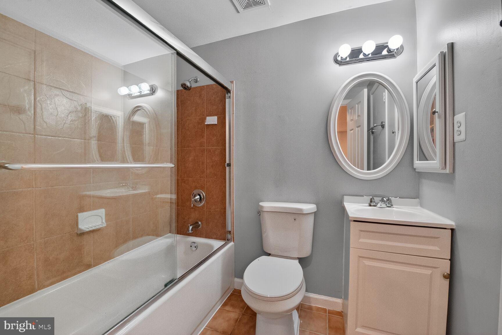 14 Braxton Drive Sterling, VA 20165 - Photo 18 of 28 a bathroom with a toilet sink vanity tub and mirror