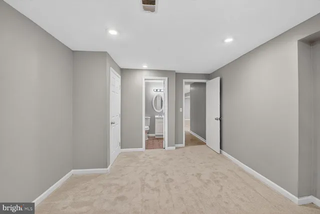 a view of a livingroom with a fireplace and window