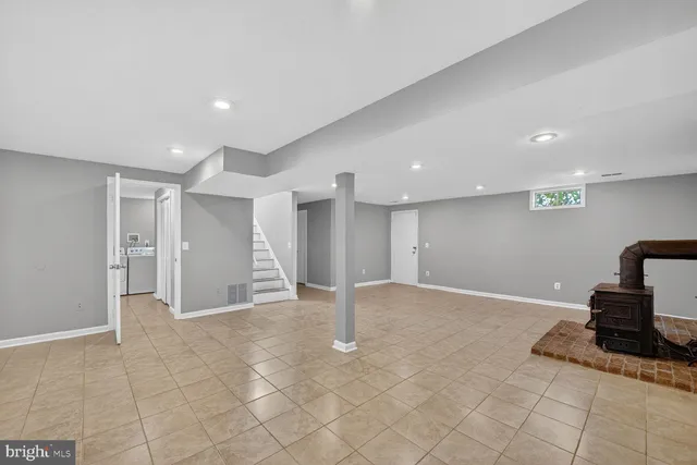 a utility room with cabinets washer and dryer