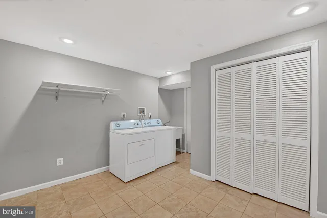 a view of staircase with wooden floor and white walls