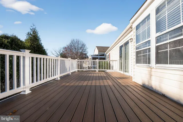a view of backyard with deck and deck