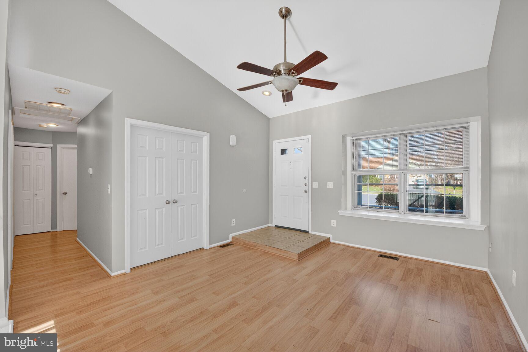 14 Braxton Drive Sterling, VA 20165 - Photo 3 of 28 a view of an empty room with wooden floor and a window