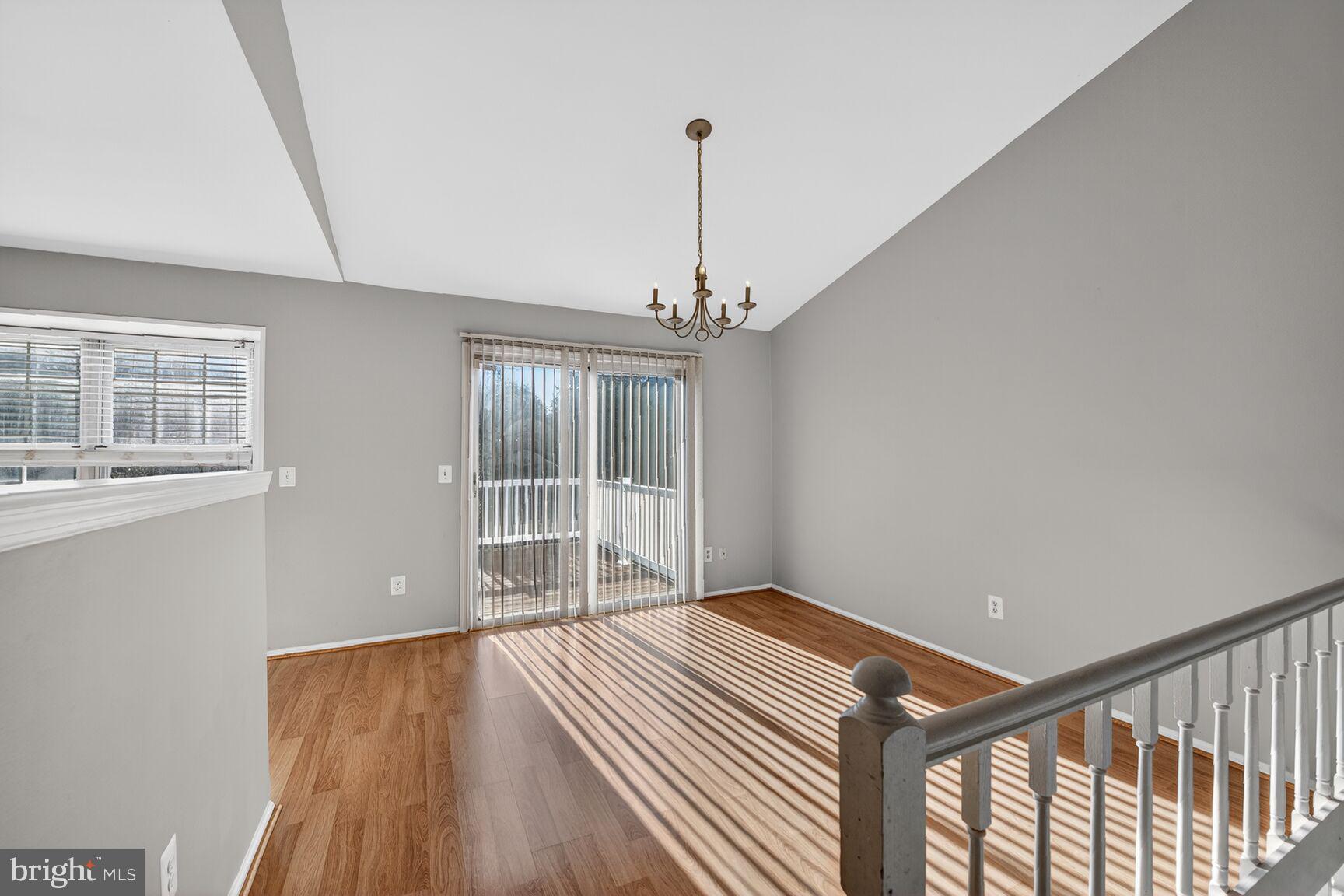 14 Braxton Drive Sterling, VA 20165 - Photo 4 of 28 a view of an empty room with wooden floor and a window