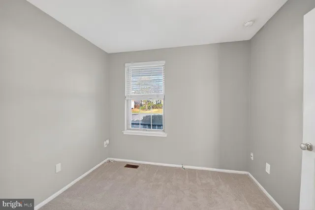 a bathroom with a shower sink vanity mirror and toilet