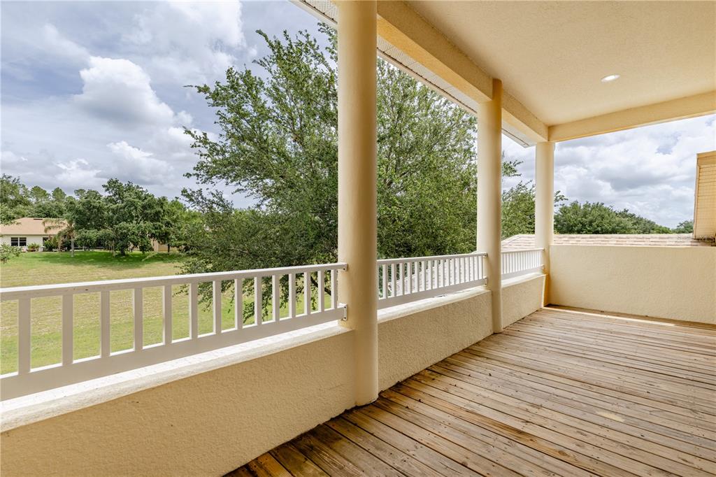 2718 Knightsbridge Road Clermont, FL 34711 - Photo 15 of 72 a view of balcony with mountain view and wooden floor