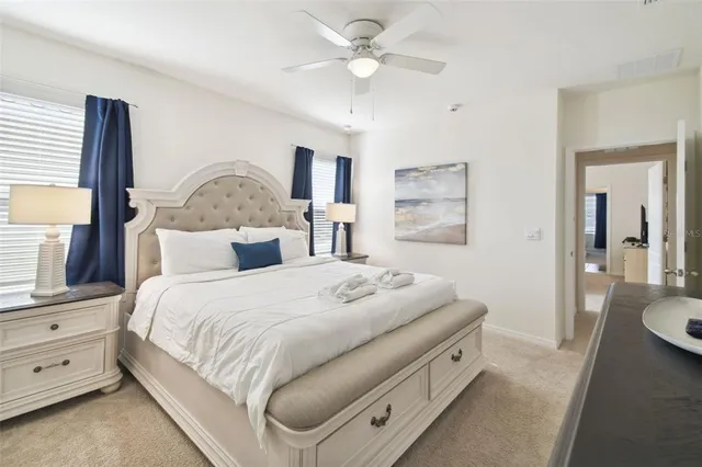 a white bath tub sitting next to a shower