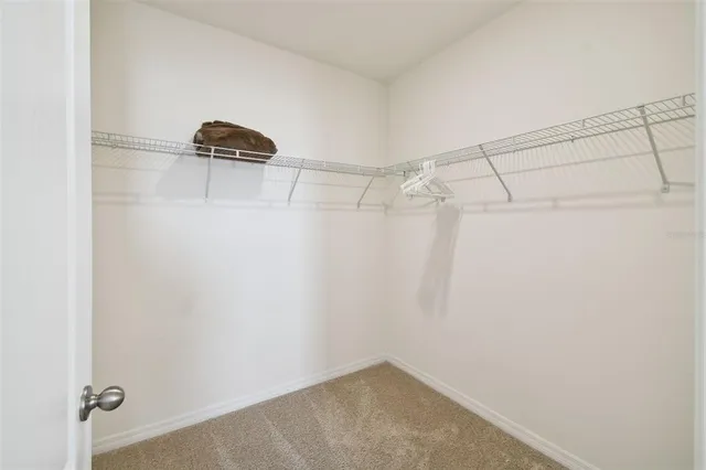 an aerial view of residential houses with outdoor space and lake view