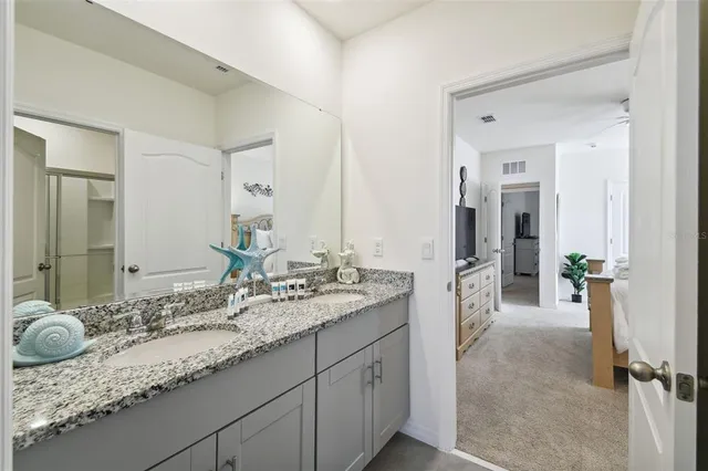 a bedroom with a bed and a tv