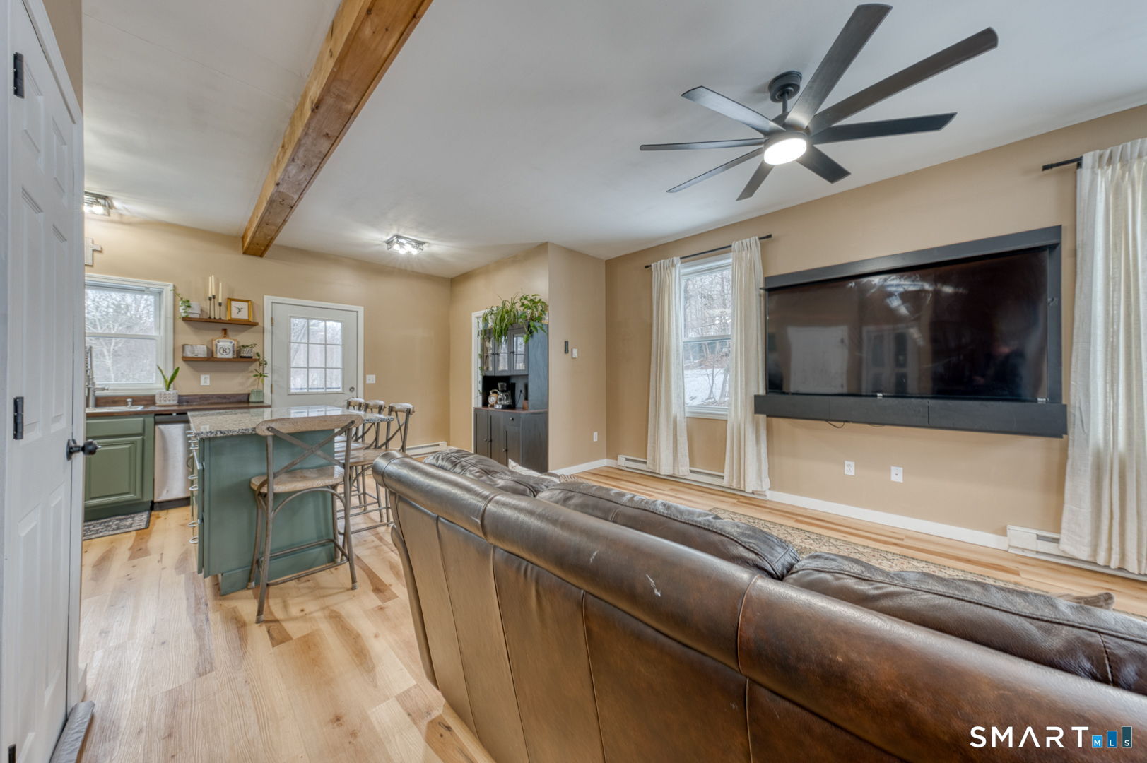 1-3 Young Street East Hampton, CT 06424 - Photo 13 of 36 a living room with stainless steel appliances kitchen island granite countertop furniture and a fireplace