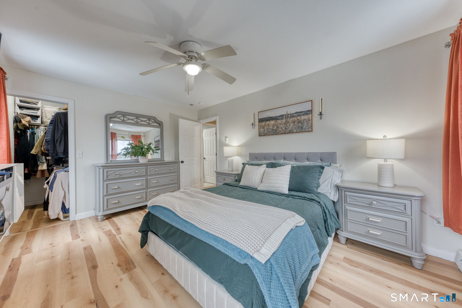 1-3 Young Street East Hampton, CT 06424 - Photo 16 of 36 a spacious bedroom with a bed and a flat tv screen on dresser
