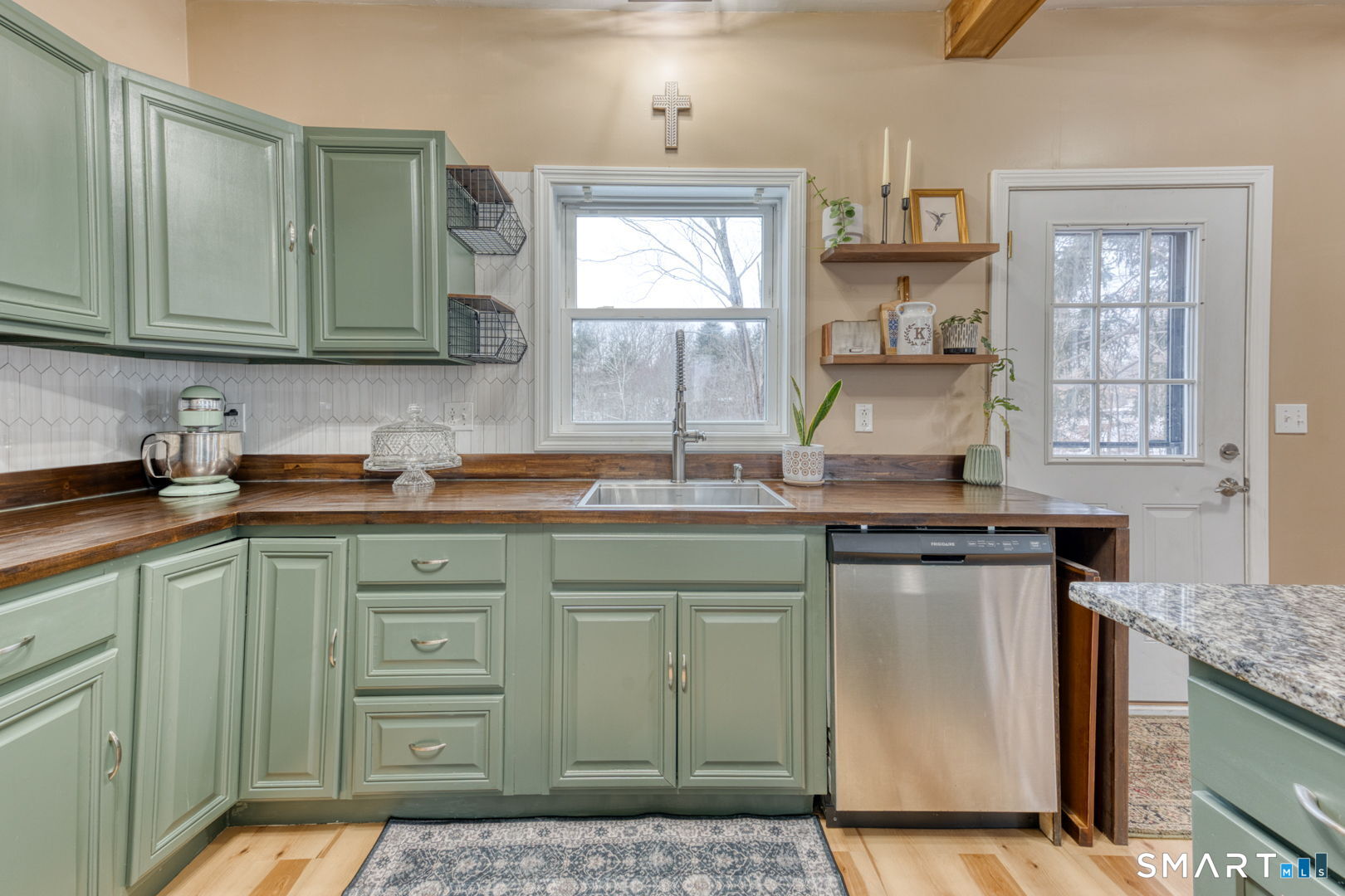1-3 Young Street East Hampton, CT 06424 - Photo 2 of 36 a kitchen with stainless steel appliances granite countertop a sink stove and cabinets