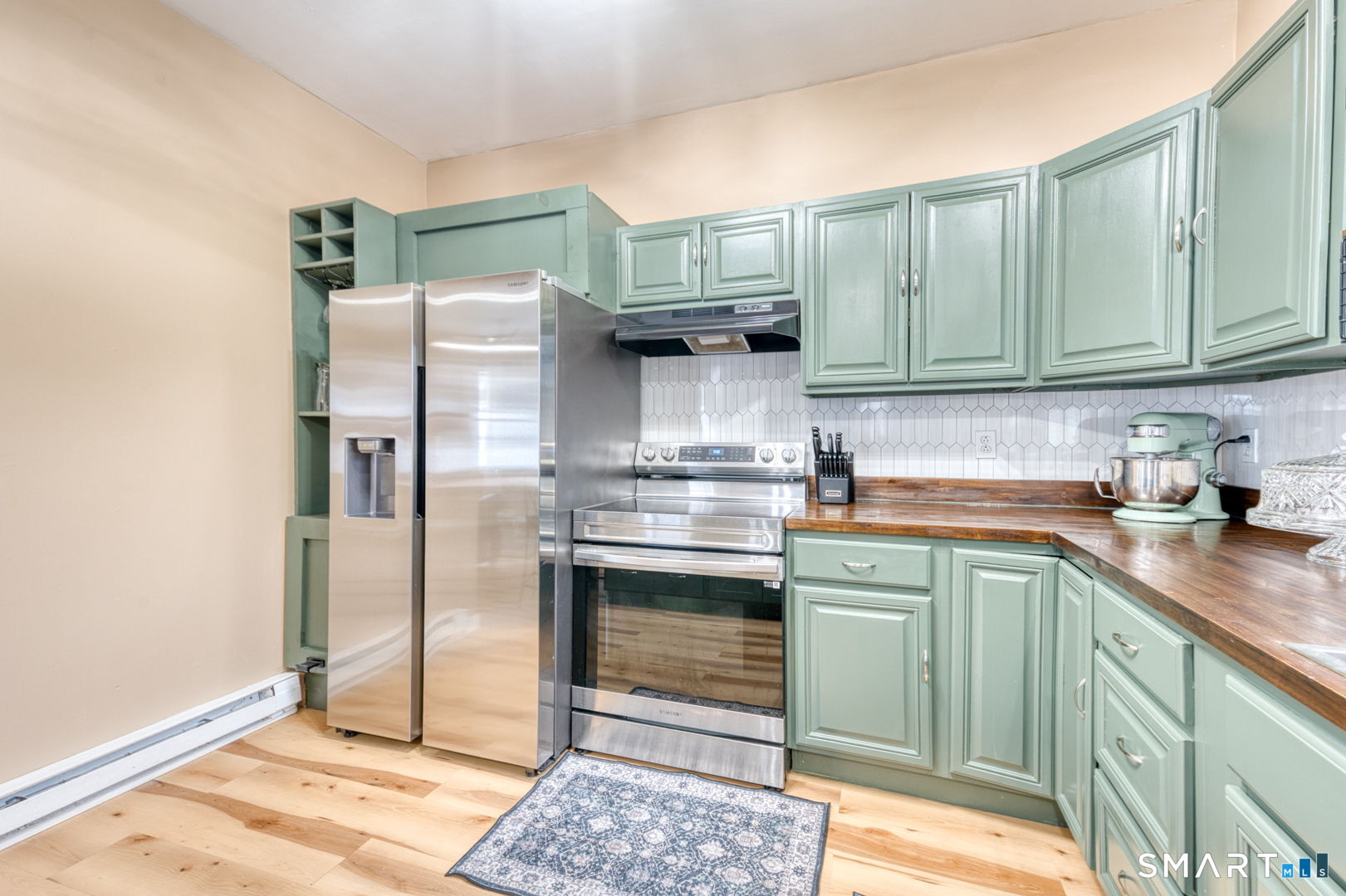 1-3 Young Street East Hampton, CT 06424 - Photo 3 of 36 a kitchen with stainless steel appliances granite countertop a refrigerator and a sink