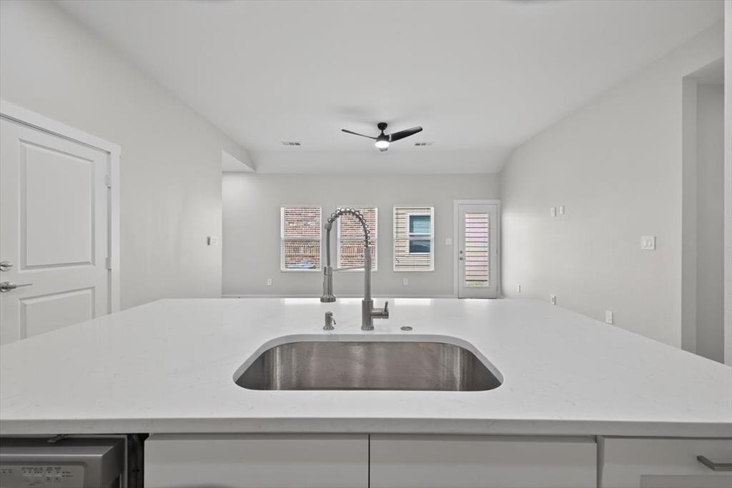 122 Wood Street, Unit A Princeton, TX 75407 - Photo 12 of 29 a kitchen with a sink and cabinets