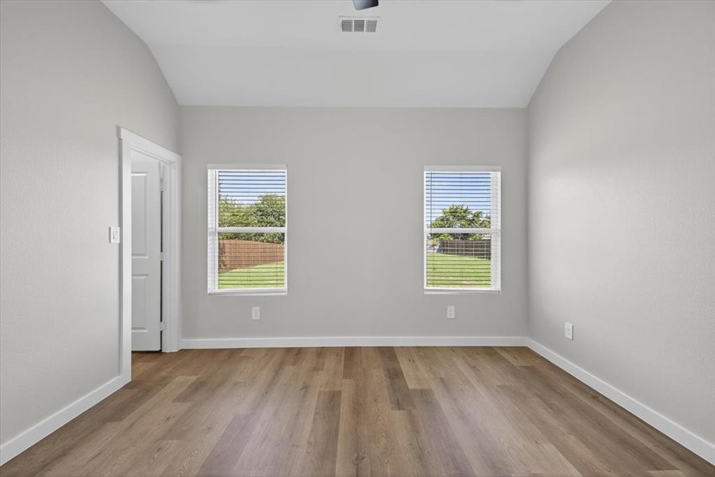 122 Wood Street, Unit A Princeton, TX 75407 - Photo 17 of 29 an empty room with a window