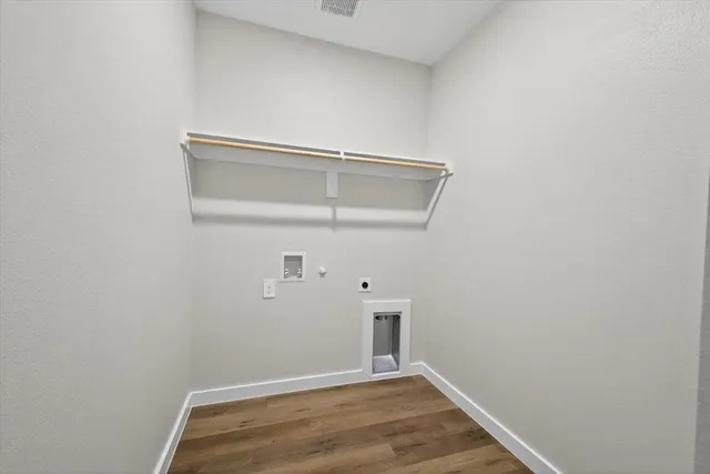 a bathroom with a toilet sink a mirror and shower