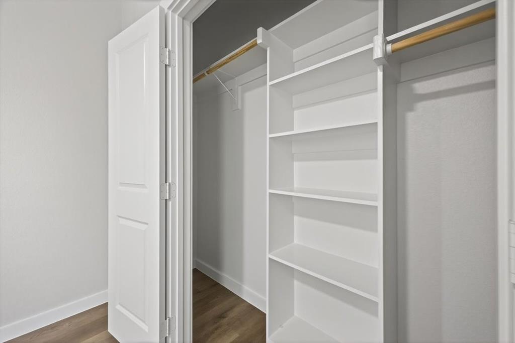 122 Wood Street, Unit A Princeton, TX 75407 - Photo 25 of 29 a view of walk in closet with empty racks