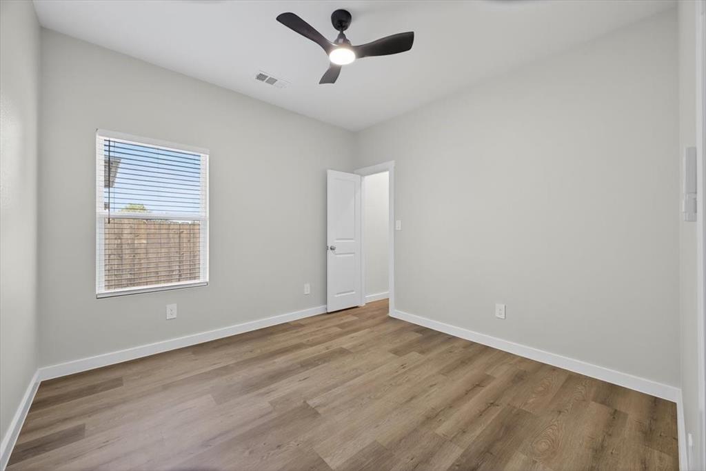 122 Wood Street, Unit A Princeton, TX 75407 - Photo 26 of 29 a view of an empty room with a window