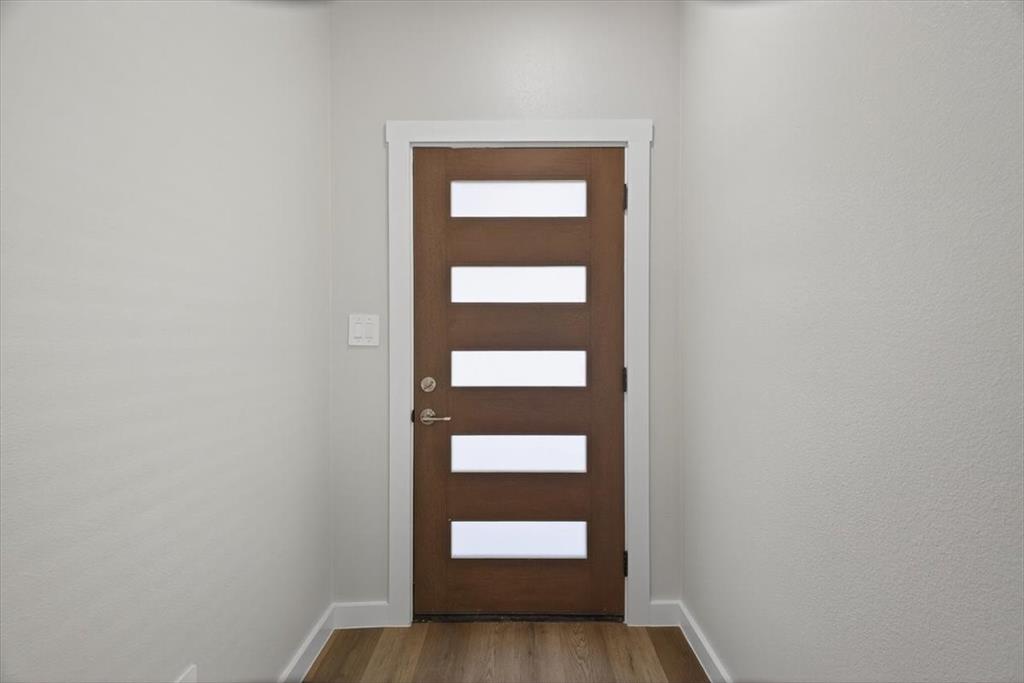 122 Wood Street, Unit A Princeton, TX 75407 - Photo 3 of 29 a view of hallway with a door and a window