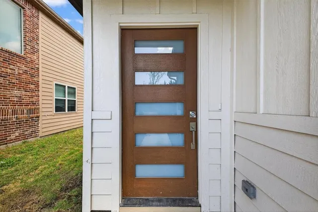 a view of kitchen with wooden floor and electronic appliances